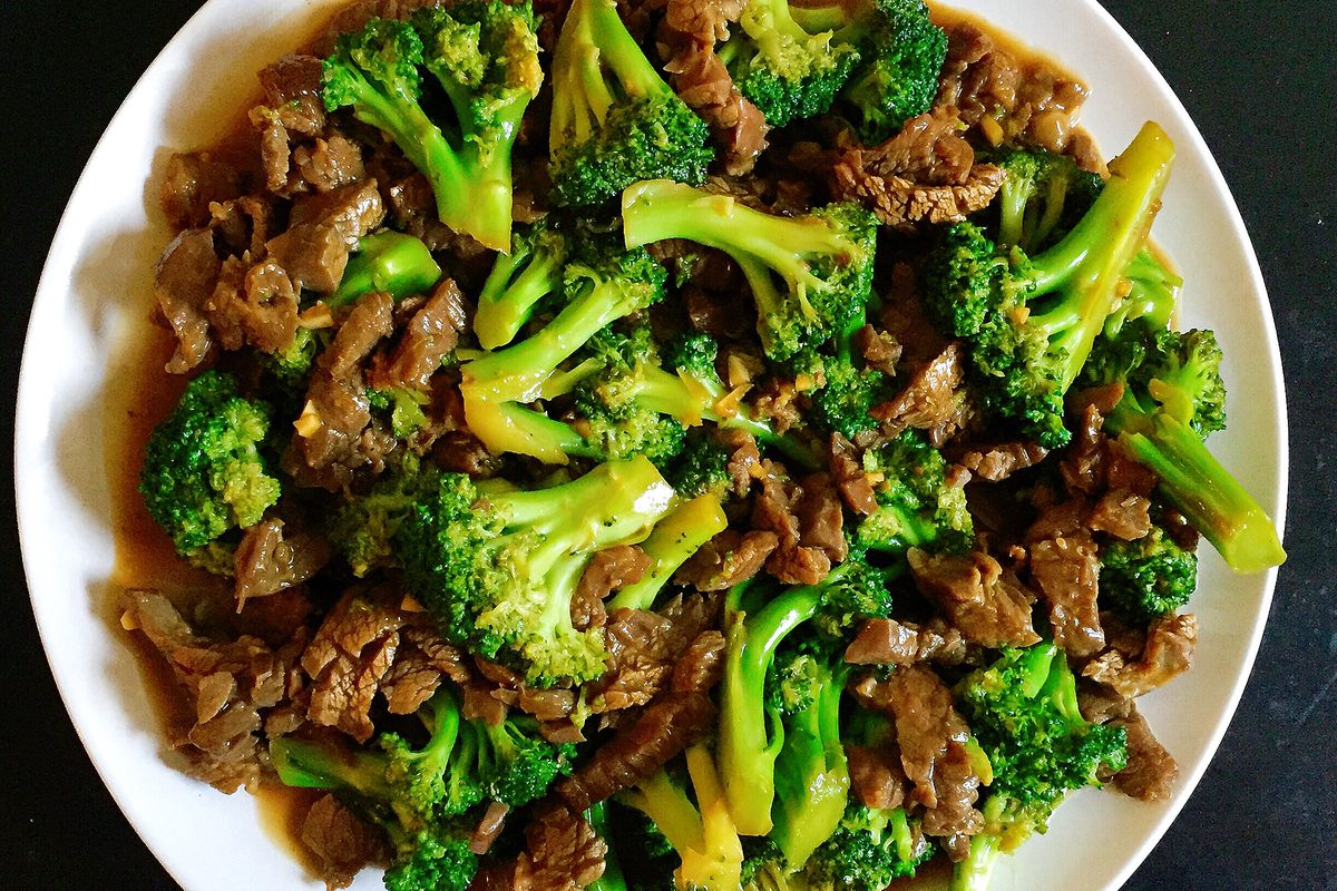 Beef and broccoli stir-fry on a white plate